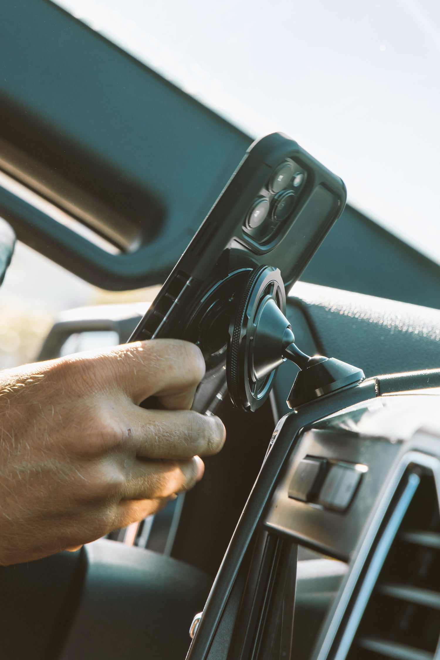 ROKFORM MagSafe iPhone case attaching to MagSafe car mount