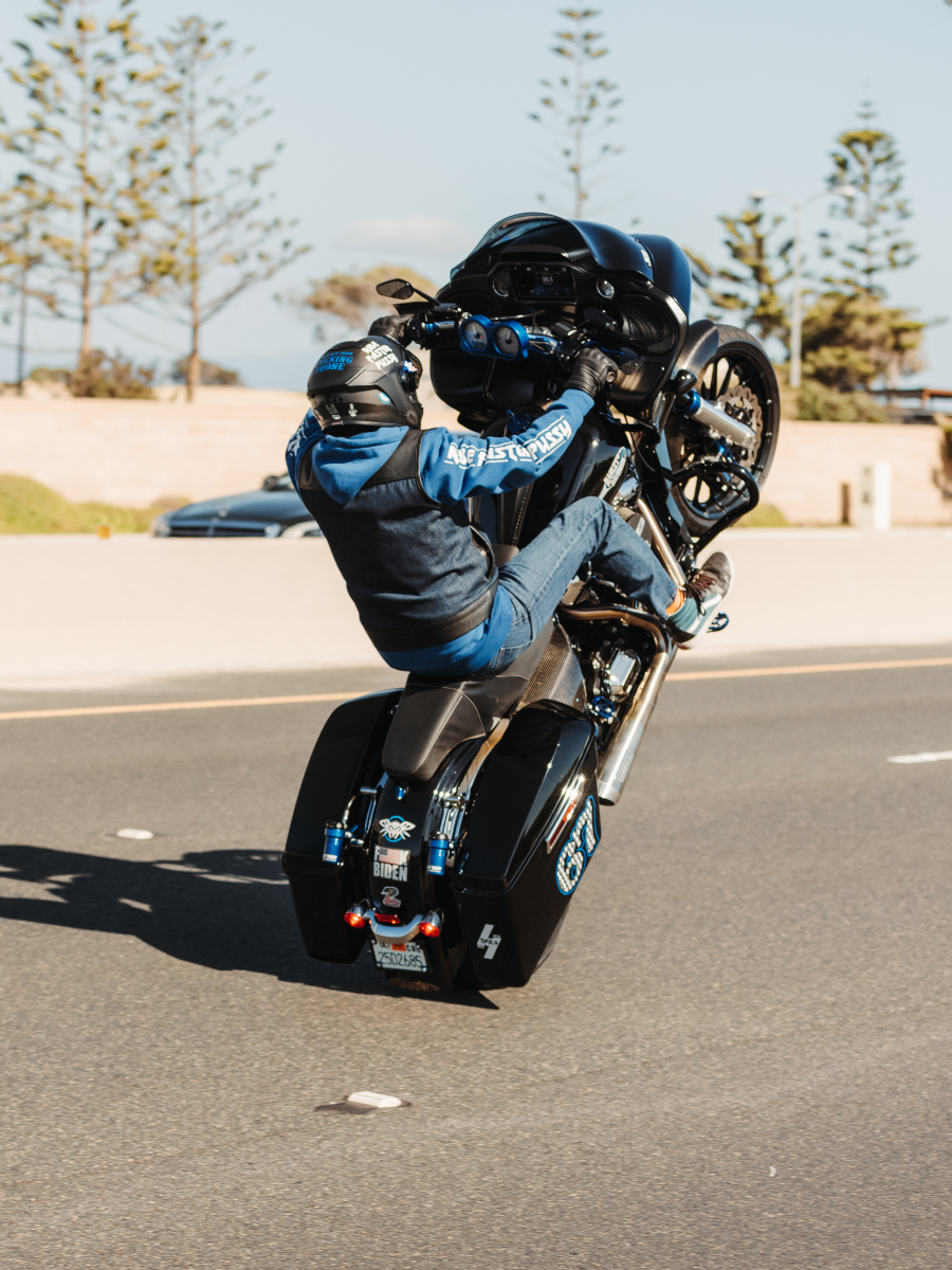 How to wheelie a motorcycle: From Physics to Freestyle